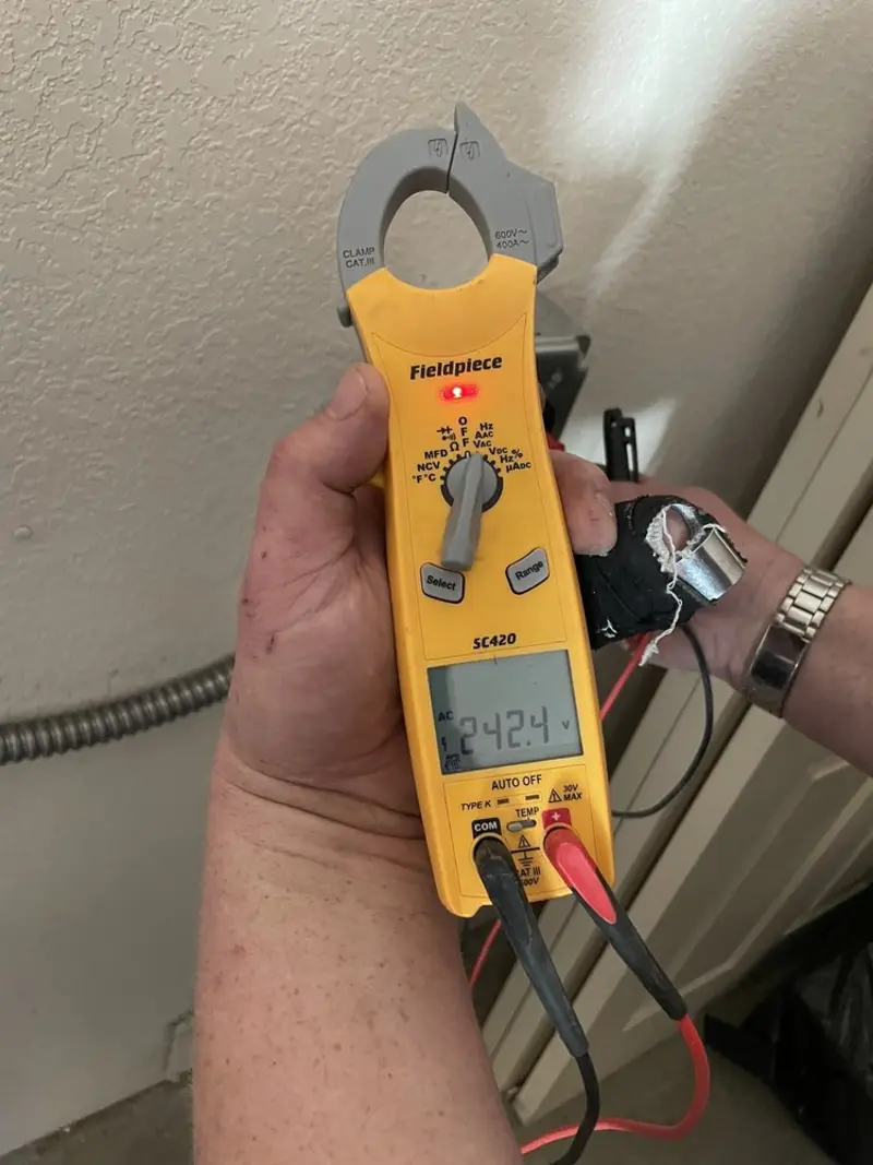Voltage testing with clamp meter during Electrical Installation Services in Rosita